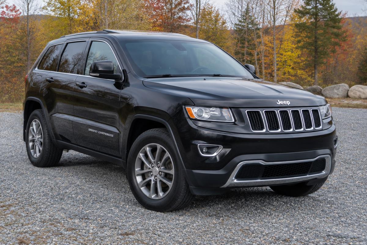 Sample photo: black SUV on gravel, front three-quarter view